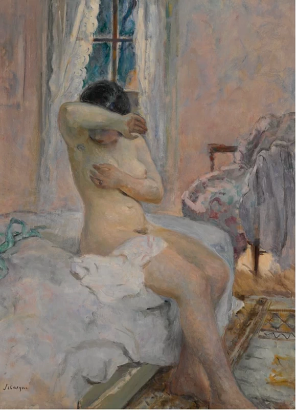 Nudo seduto sul letto